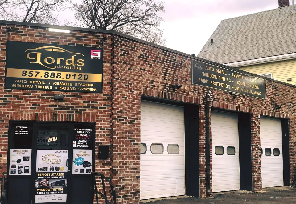 The Lords Detailing shop at 111 Chelsea St in Everett: red brick, three bay doors and the gold Lords sign